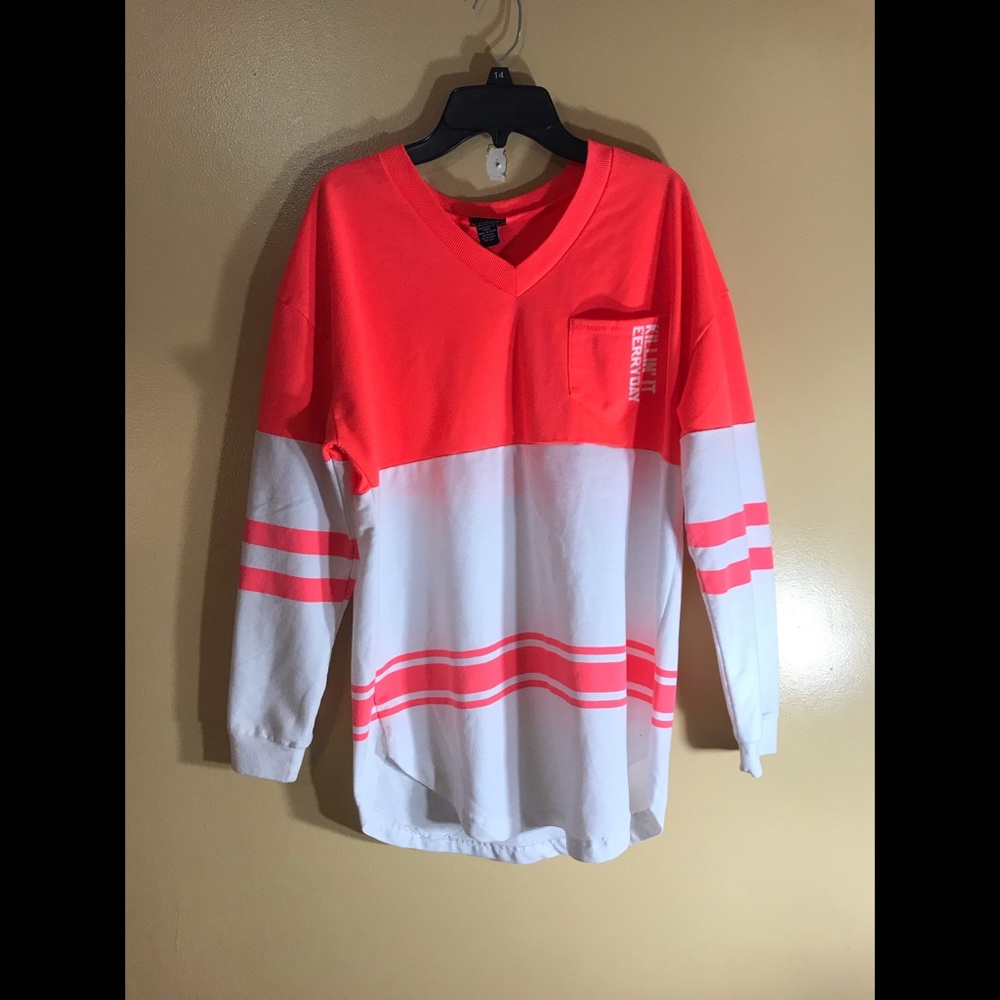 Bright pink and white long sleeve shirt.